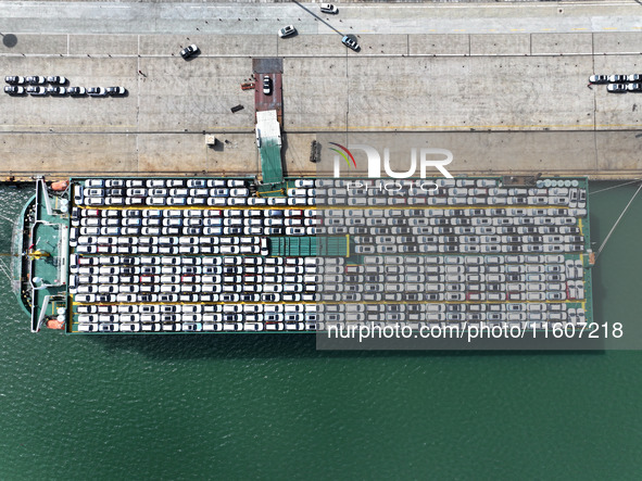 Roll-on wheels load export vehicles at the terminal of the Oriental Port Branch of Lianyungang Port in Lianyungang, China, on September 25,...