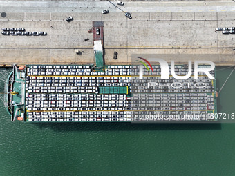 Roll-on wheels load export vehicles at the terminal of the Oriental Port Branch of Lianyungang Port in Lianyungang, China, on September 25,...