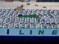 Roll-on wheels load export vehicles at the terminal of the Oriental Port Branch of Lianyungang Port in Lianyungang, China, on September 25,...