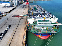 Roll-on wheels load export vehicles at the terminal of the Oriental Port Branch of Lianyungang Port in Lianyungang, China, on September 25,...