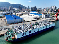 Roll-on wheels load export vehicles at the terminal of the Oriental Port Branch of Lianyungang Port in Lianyungang, China, on September 25,...