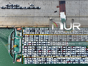 Roll-on wheels load export vehicles at the terminal of the Oriental Port Branch of Lianyungang Port in Lianyungang, China, on September 25,...