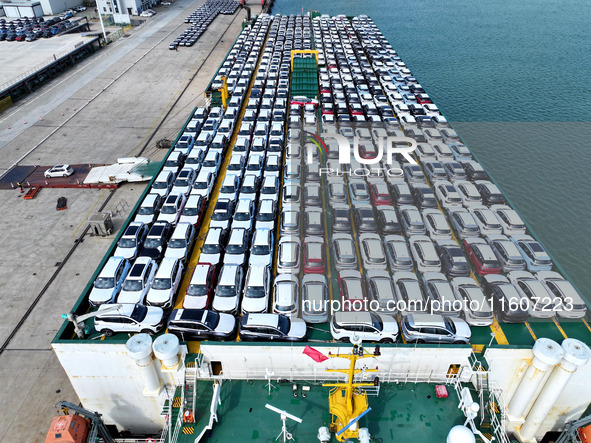 Roll-on wheels load export vehicles at the terminal of the Oriental Port Branch of Lianyungang Port in Lianyungang, China, on September 25,...