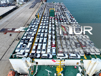 Roll-on wheels load export vehicles at the terminal of the Oriental Port Branch of Lianyungang Port in Lianyungang, China, on September 25,...