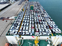 Roll-on wheels load export vehicles at the terminal of the Oriental Port Branch of Lianyungang Port in Lianyungang, China, on September 25,...