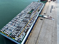 Roll-on wheels load export vehicles at the terminal of the Oriental Port Branch of Lianyungang Port in Lianyungang, China, on September 25,...