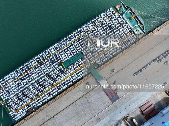 Roll-on wheels load export vehicles at the terminal of the Oriental Port Branch of Lianyungang Port in Lianyungang, China, on September 25,...