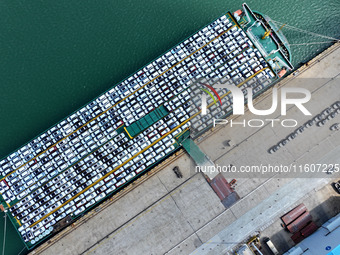 Roll-on wheels load export vehicles at the terminal of the Oriental Port Branch of Lianyungang Port in Lianyungang, China, on September 25,...