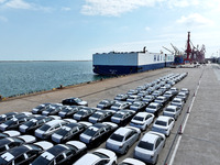 Roll-on wheels load export vehicles at the terminal of the Oriental Port Branch of Lianyungang Port in Lianyungang, China, on September 25,...