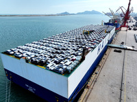 Roll-on wheels load export vehicles at the terminal of the Oriental Port Branch of Lianyungang Port in Lianyungang, China, on September 25,...