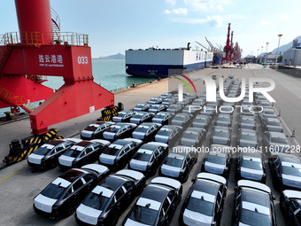 Roll-on wheels load export vehicles at the terminal of the Oriental Port Branch of Lianyungang Port in Lianyungang, China, on September 25,...