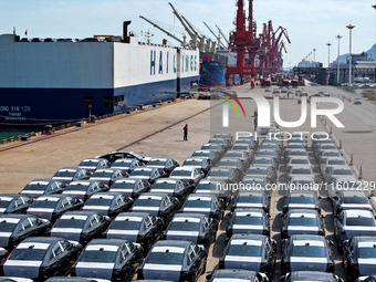 Roll-on wheels load export vehicles at the terminal of the Oriental Port Branch of Lianyungang Port in Lianyungang, China, on September 25,...