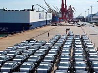 Roll-on wheels load export vehicles at the terminal of the Oriental Port Branch of Lianyungang Port in Lianyungang, China, on September 25,...