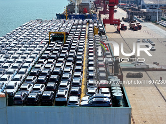 Roll-on wheels load export vehicles at the terminal of the Oriental Port Branch of Lianyungang Port in Lianyungang, China, on September 25,...