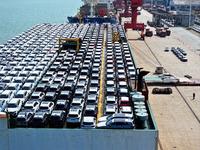 Roll-on wheels load export vehicles at the terminal of the Oriental Port Branch of Lianyungang Port in Lianyungang, China, on September 25,...