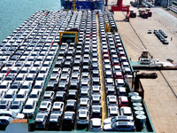 Roll-on wheels load export vehicles at the terminal of the Oriental Port Branch of Lianyungang Port in Lianyungang, China, on September 25,...