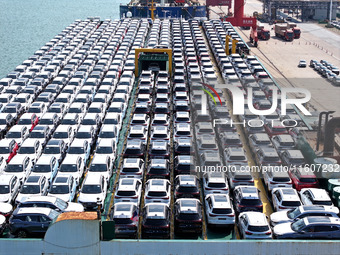 Roll-on wheels load export vehicles at the terminal of the Oriental Port Branch of Lianyungang Port in Lianyungang, China, on September 25,...