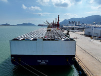 Roll-on wheels load export vehicles at the terminal of the Oriental Port Branch of Lianyungang Port in Lianyungang, China, on September 25,...