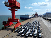 Roll-on wheels load export vehicles at the terminal of the Oriental Port Branch of Lianyungang Port in Lianyungang, China, on September 25,...