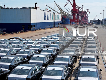 Roll-on wheels load export vehicles at the terminal of the Oriental Port Branch of Lianyungang Port in Lianyungang, China, on September 25,...