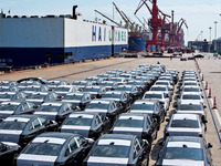 Roll-on wheels load export vehicles at the terminal of the Oriental Port Branch of Lianyungang Port in Lianyungang, China, on September 25,...