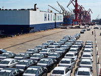 Roll-on wheels load export vehicles at the terminal of the Oriental Port Branch of Lianyungang Port in Lianyungang, China, on September 25,...