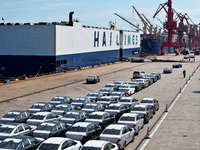 Roll-on wheels load export vehicles at the terminal of the Oriental Port Branch of Lianyungang Port in Lianyungang, China, on September 25,...