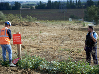 An NGE/Atosca worker places a placard reading 'construction site forbidden to public' under gendarmes' protection. For the fifth day, the Ge...