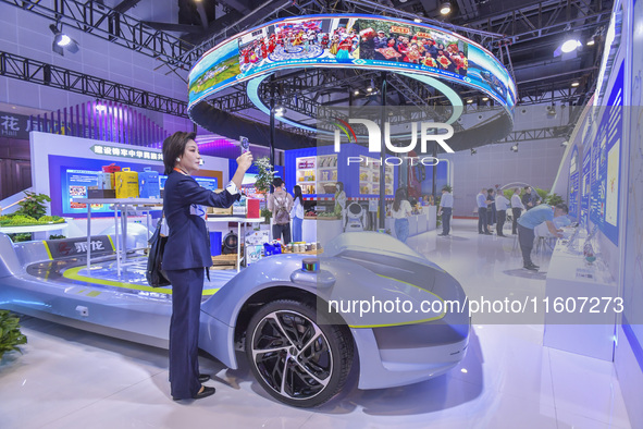 Visitors visit the booth of Beibu Gulf Port Group at the 21st China-Asean Expo in Nanning, China, on September 25, 2024. 