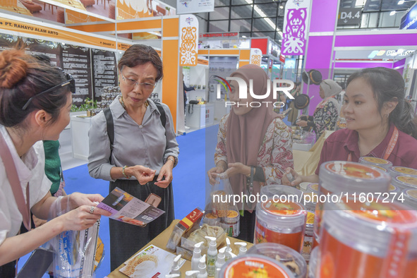 Visitors visit Indonesia's stand at the 21st China-Asean Expo in Nanning, China, on September 25, 2024. 