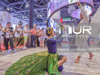 Visitors visit Cambodia's stand at the 21st China-Asean Expo in Nanning, China, on September 25, 2024. (