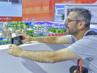 Foreign businessmen visit the stand of China Energy Group at the 21st China-Asean Expo in Nanning, China, on September 25, 2024. (