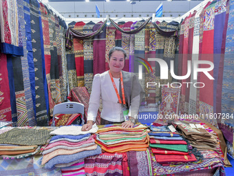 Visitors view Indonesian textile products at the 21st China-Asean Expo in Nanning, China, on September 25, 2024. (