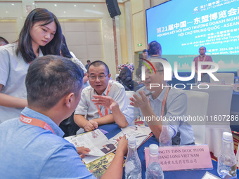 Businessmen exchange views at the 21st China-Asean Expo in Nanning, China, on September 25, 2024. (