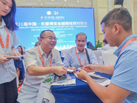 Businessmen exchange views at the 21st China-Asean Expo in Nanning, China, on September 25, 2024. (