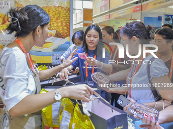 Visitors shop for Vietnamese food at the 21st China-Asean Expo in Nanning, Guangxi Zhuang Autonomous Region, China, on September 25, 2024. (