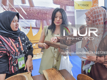 Visitors view Indonesian handicrafts at the 21st China-Asean Expo in Nanning, China, on September 25, 2024. (