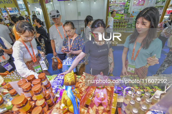 Visitors shop for Vietnamese food at the 21st China-Asean Expo in Nanning, Guangxi Zhuang Autonomous Region, China, on September 25, 2024. 