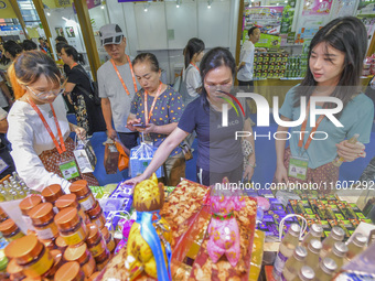 Visitors shop for Vietnamese food at the 21st China-Asean Expo in Nanning, Guangxi Zhuang Autonomous Region, China, on September 25, 2024. (