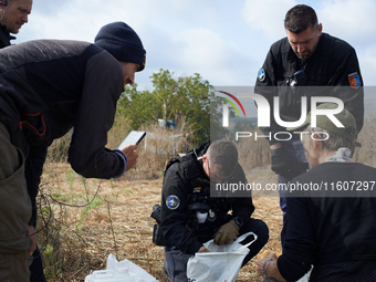 Gendarmes inspect bags of food and water for 'ecureuils' (i.e., 'squirrels'). For the 5th day, Gendarmerie and CNAMO try to dislodge 'Ecureu...