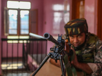 An Indian paramilitary soldier stands guard during the second phase of assembly elections in Srinagar, Jammu and Kashmir, on September 25, 2...