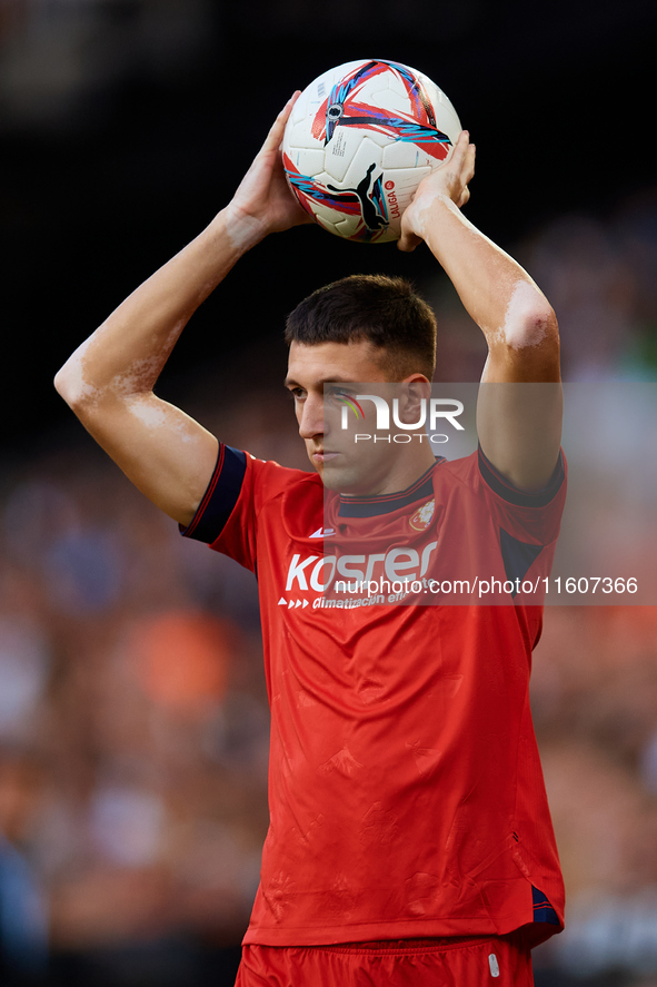 Abel Bretones of CA Osasuna takes a throw-in during the LaLiga EA Sports match between Valencia CF and CA Osasuna at Mestalla stadium in Val...