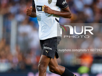 Cristhian Mosquera of Valencia CF runs during the LaLiga EA Sports match between Valencia CF and CA Osasuna at Mestalla stadium in Valencia,...