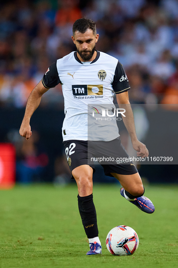 Luis Rioja of Valencia CF is in action during the LaLiga EA Sports match between Valencia CF and CA Osasuna at Mestalla stadium in Valencia,...