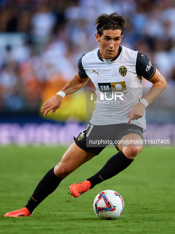 Jesus Vazquez of Valencia CF is in action during the LaLiga EA Sports match between Valencia CF and CA Osasuna at Mestalla stadium in Valenc...