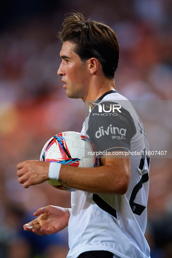 Jesus Vazquez of Valencia CF holds the ball during the LaLiga EA Sports match between Valencia CF and CA Osasuna at Mestalla stadium in Vale...