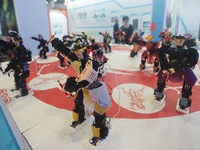 Visitors watch a robot perform a song and dance performance at the Global Digital Trade Expo in Hangzhou, Zhejiang province, China, on Septe...