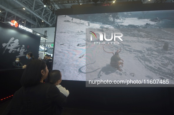 The audience visits and experiences the first domestically produced 3A game "Black Myth: Wukong" at the Global Digital Trade Expo in Hangzho...