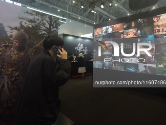 The audience visits and experiences the first domestically produced 3A game "Black Myth: Wukong" at the Global Digital Trade Expo in Hangzho...