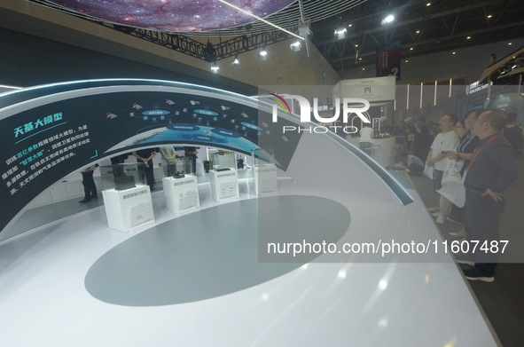 The audience visits the subsystem of the Liangzhu satellite constellation with a space-based AI model at the Global Digital Trade Expo in Ha...